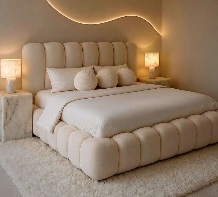 Cream channel-tufted Bubble sleigh bed with panelled headboard and rounded padded base