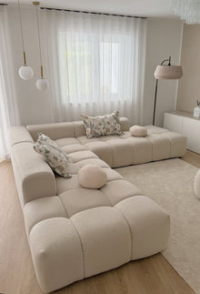 Cumulus modular sectional in an L-shape configuration with chaise module