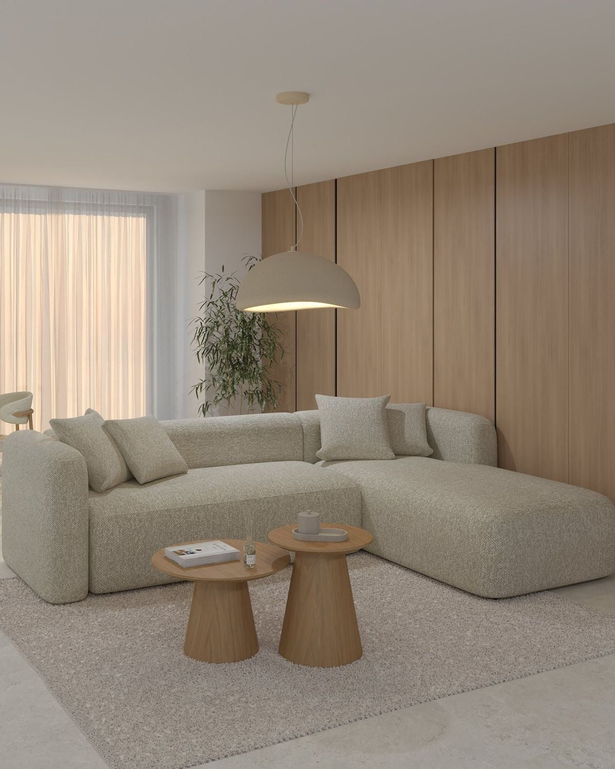 Textured cream Nimbus curved L-shape couch with rounded arm and open chaise in a modern living room